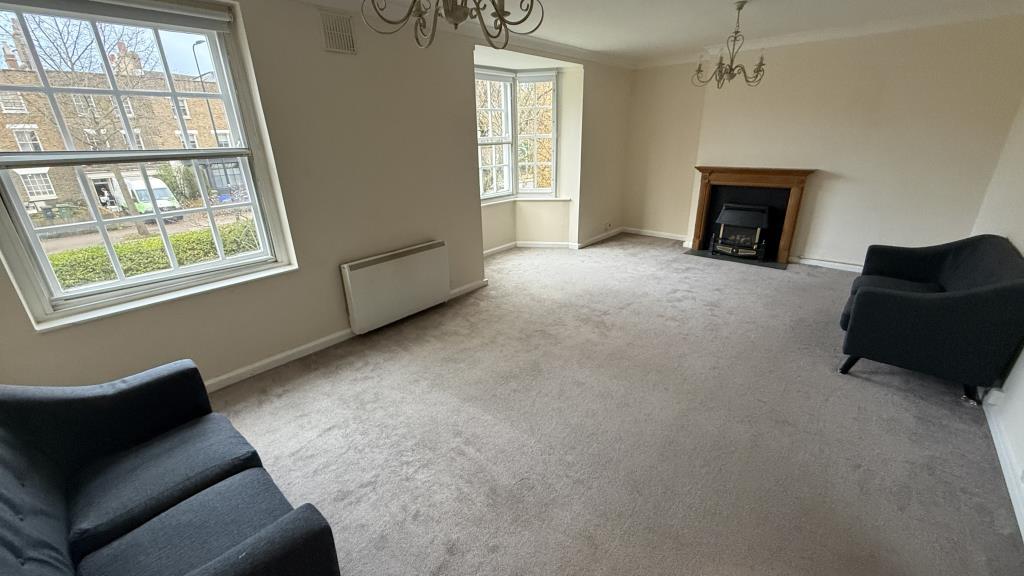 Lot: 127 - LONG LEASE TWO-BEDROOM FLAT FOR INVESTMENT OR OWNER OCCUPATION - Internal image of living room from another angle